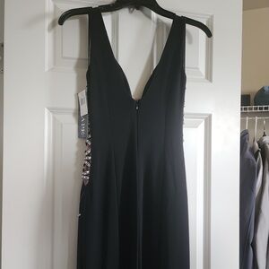 Xscape Black Backless V-Neck Evening Gown with Side Lace Accent